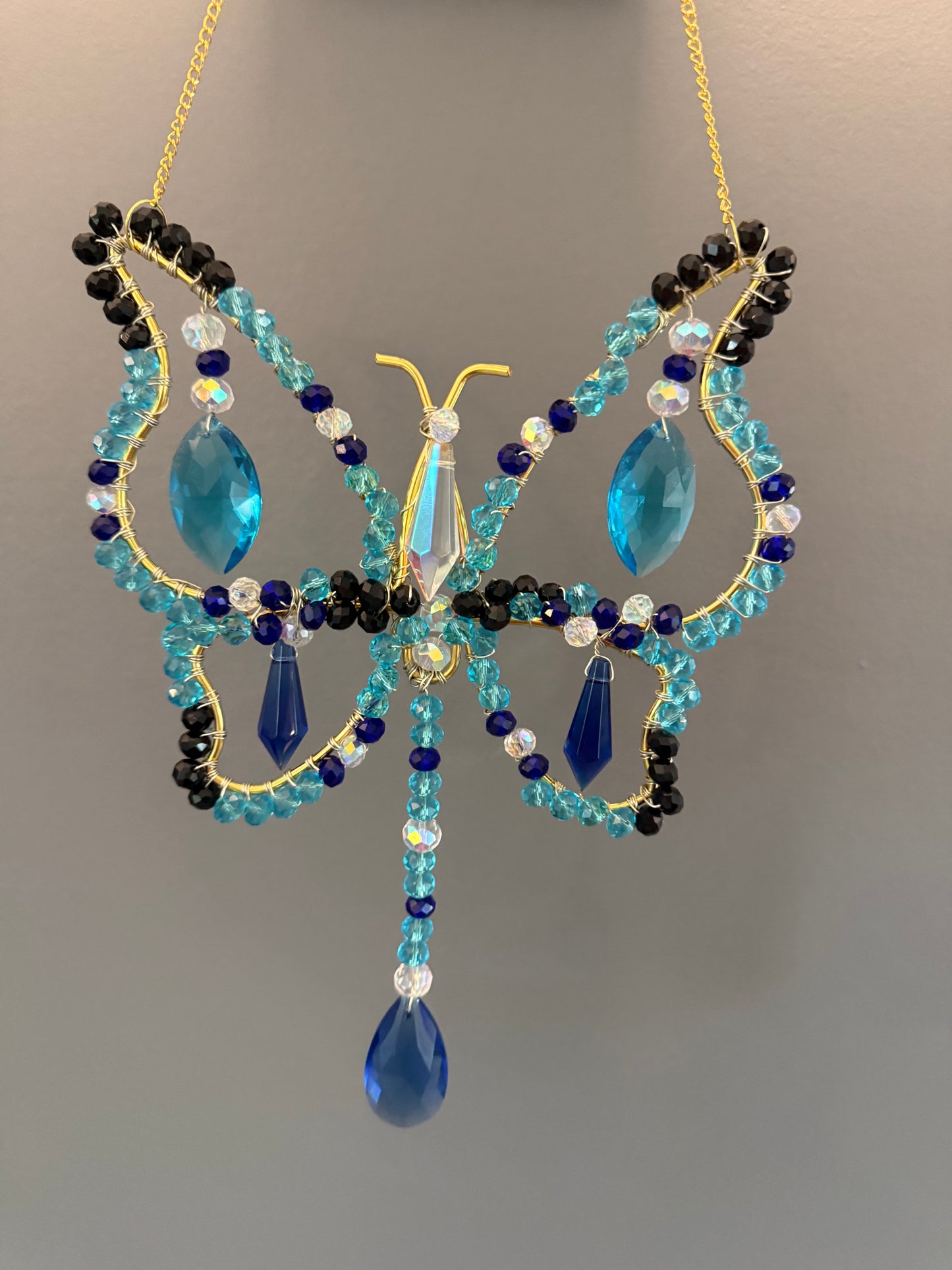 Aqua blue, dark blue, black and white Butterfly Suncatcher