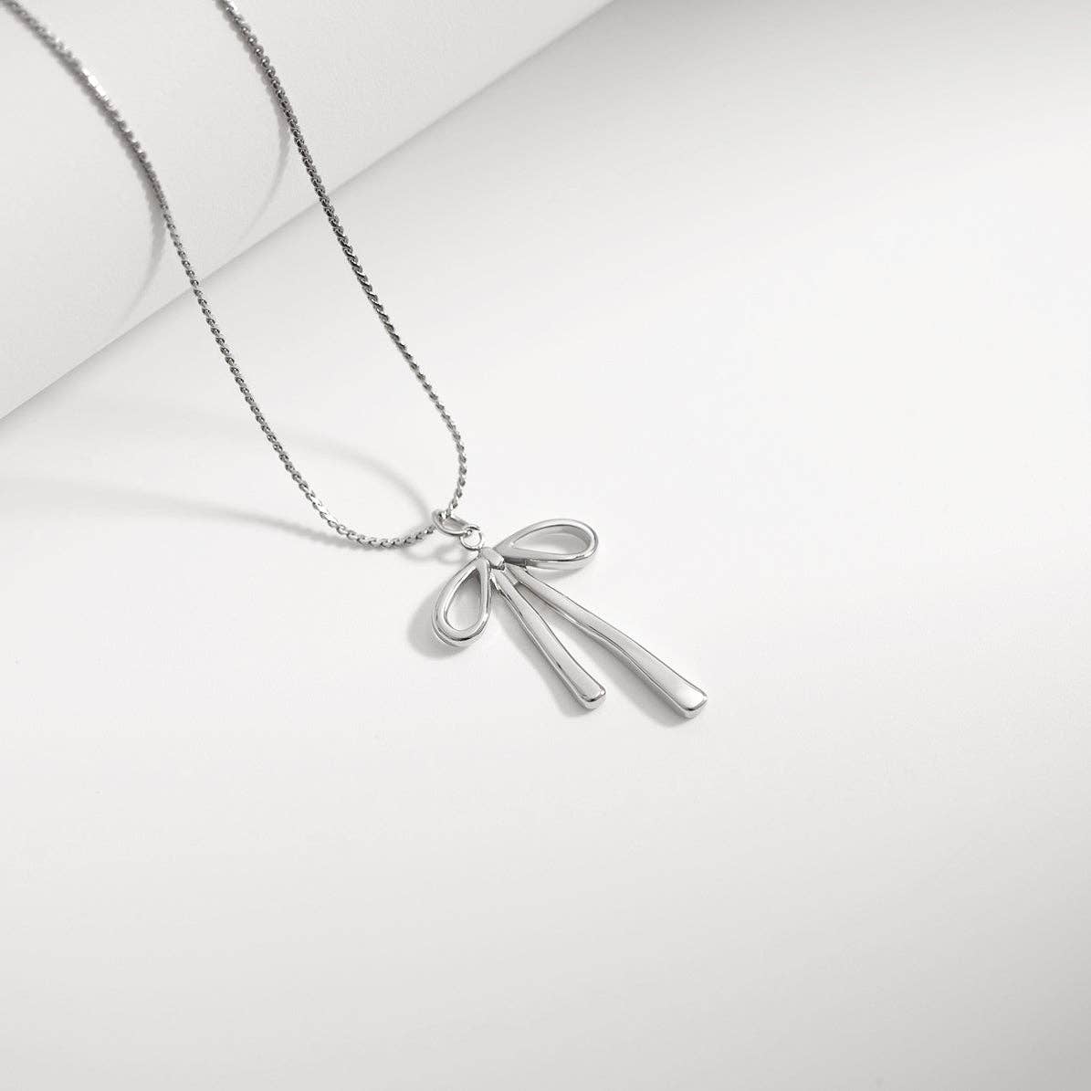 18K Gold PVD Stainless Steel Long Bow Charm: Gold